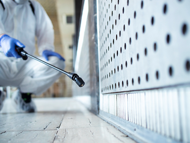 Worker inspecting mold